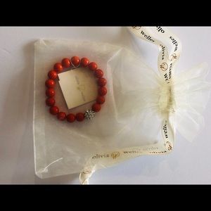 Coral colored beaded bracelet.